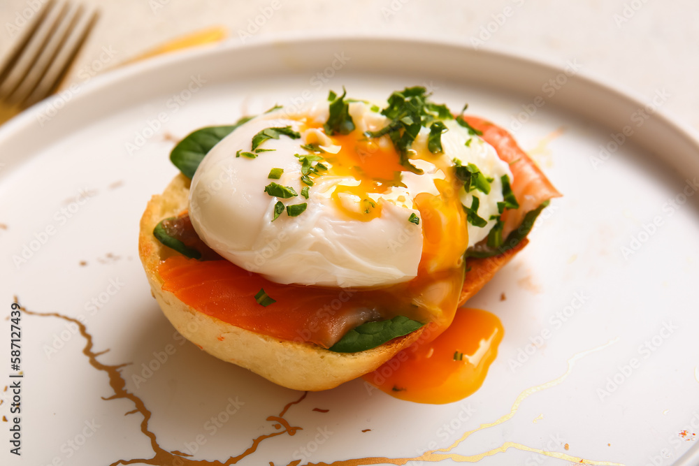 Plate with delicious egg Benedict on table, closeup Plate with delicious egg Benedict on table, closeup