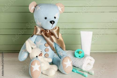 Toy bear and bunny with bat...
