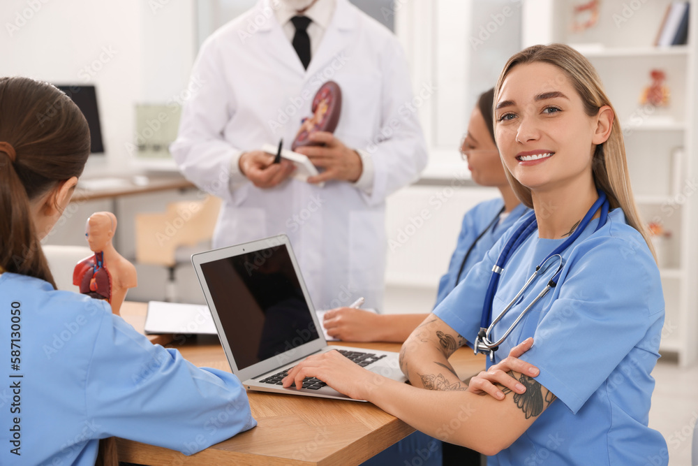 Portrait of young intern wearing uniform on lecture in university Portrait of young intern wearing uniform on lecture in university