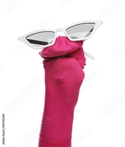 Funny sock puppet with sunglasses isolated on white photo