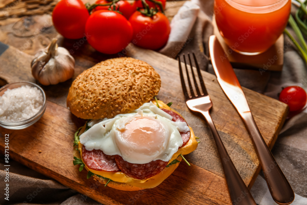 Wooden board with tasty egg Benedict on table Wooden board with tasty egg Benedict on table