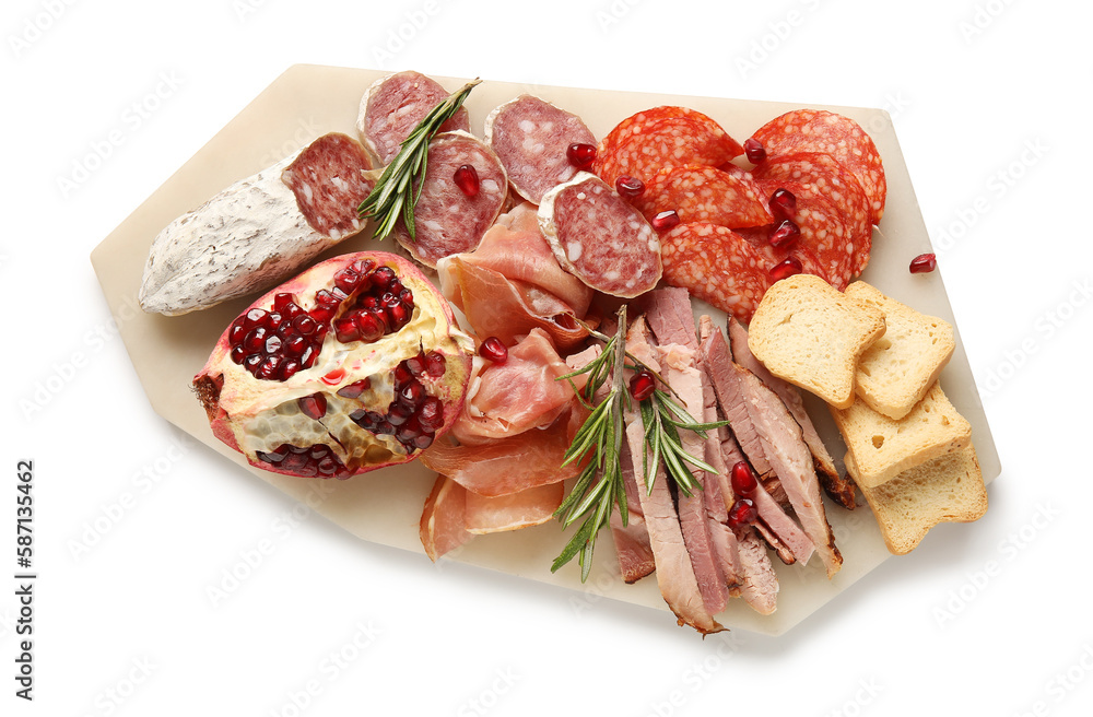Board with assortment of tasty deli meats isolated on white background