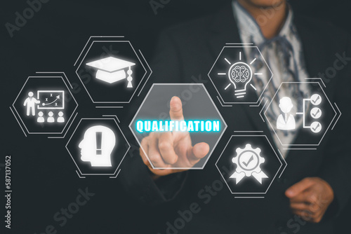 Qualification concept, Person hand touching qualification icon on virtual screen.
