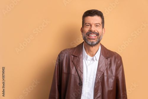 portrait of brazilian man smiling and looking at camera in studio shot. portrait, real people concept.