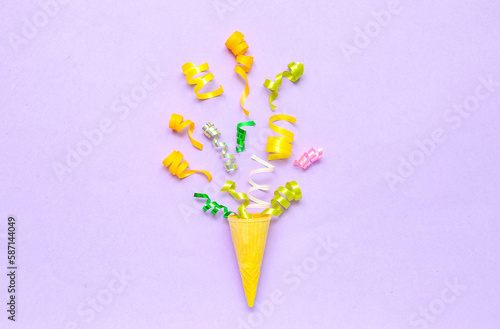 Composition with ice cream cone on lilac background