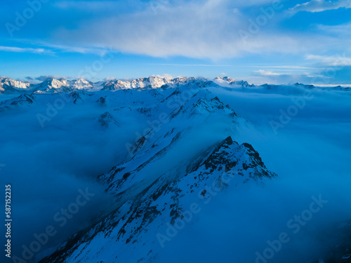 Aerial photography of beautiful snow-capped mountains and sea of clouds at sunset at Sichuan China