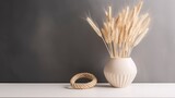A white vase with wheat ears in it sits on a white table. Generative AI