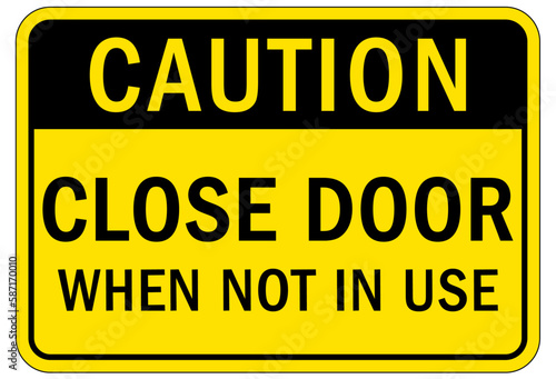 Door safety sign and labels close door when not in use