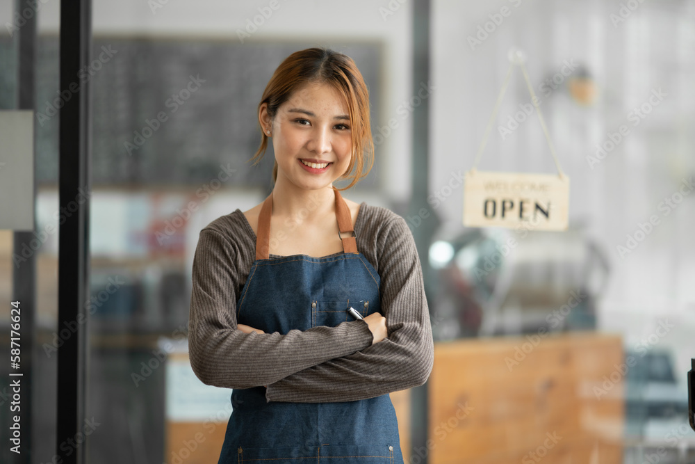 Asian female employees greet customers at a coffee shop.