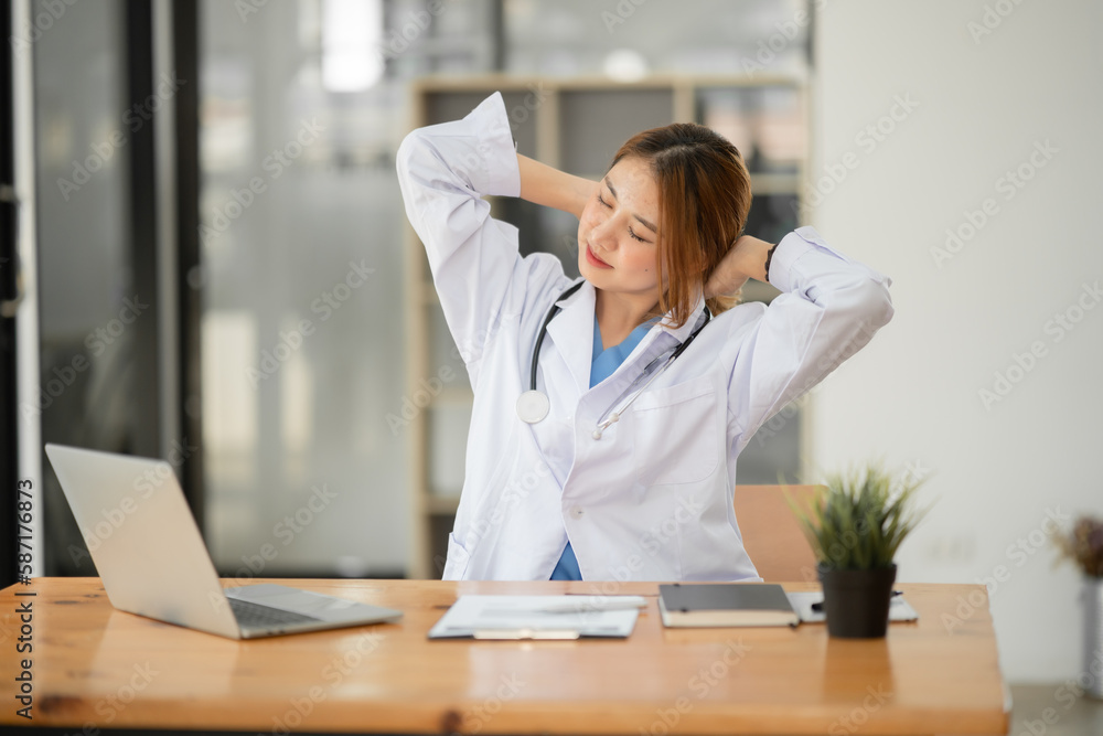 Asian female doctor Tired of working, exhausted, sleepy at the clinic or hospital Asian female doctor Tired of working, exhausted, sleepy at the clinic or hospital