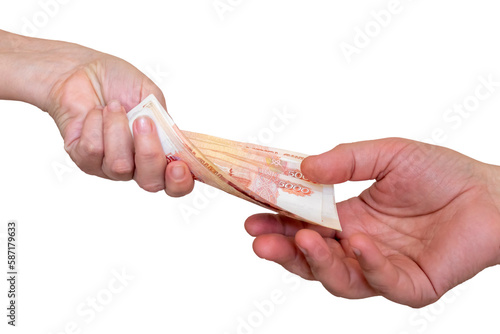 A woman's hand extends money 5000 rubles to a man's hand. From hand to hand. Isolated on a white background.