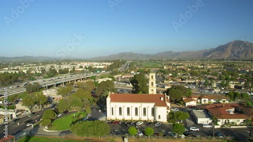 Aerial Forward Panning Shot Of Famous Catholic Church On Sunny Day Against Clear Sky During Sunny Day - Camarillo, California photo