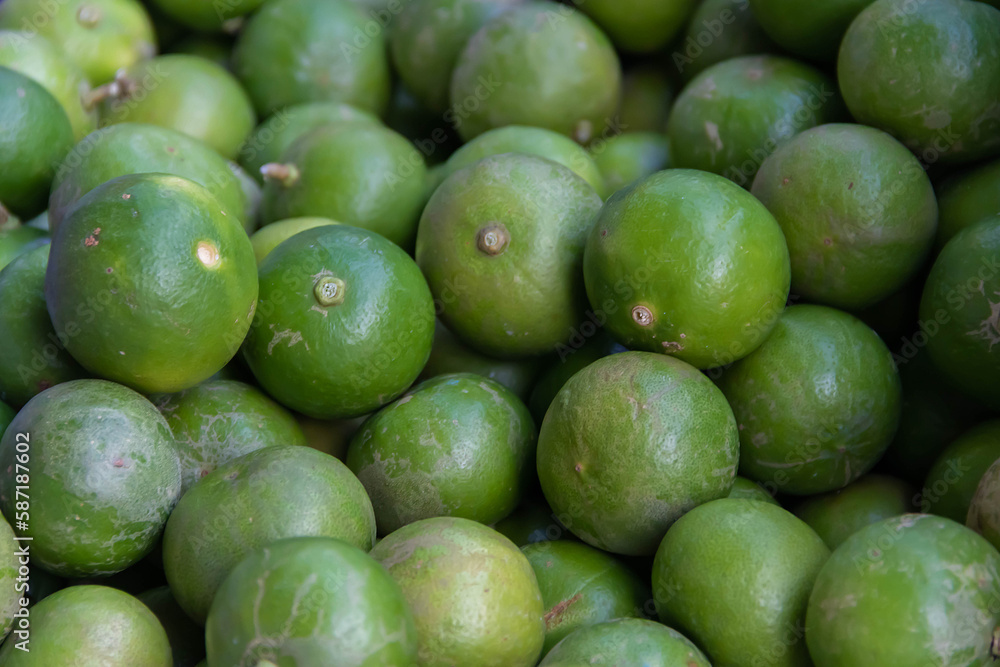 Stack of limes on display at street market with drink fresh lemonade. Stack of limes on display at street market with drink fresh lemonade.
