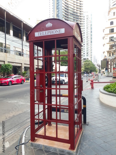 Red Telephone Booth on footpath