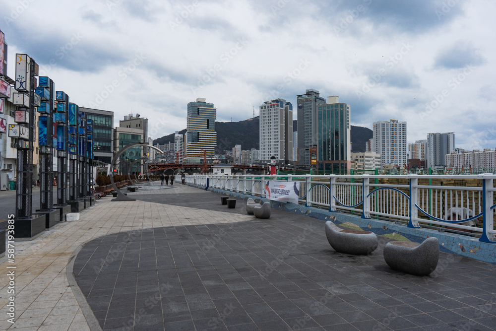 Busan city view and Sea Port during winter evening cloudy day at Jung-gu , Busan South Korea : 9 February 2023 Busan city view and Sea Port during winter evening cloudy day at Jung-gu , Busan South Korea : 9 February 2023