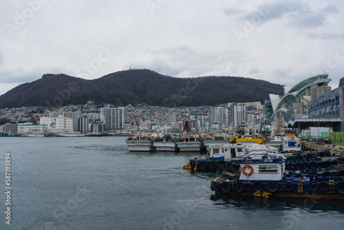 Busan city view and Sea Port during winter evening cloudy day at Jung-gu , Busan  South Korea : 9 February 2023 photo