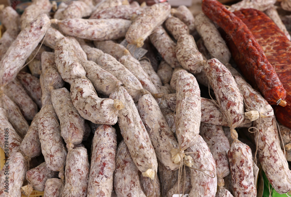 Traditional meat products sold at a street stall during the farmers market in Cremona, Lombardy, Italy Traditional meat products sold at a street stall during the farmers market in Cremona, Lombardy, Italy