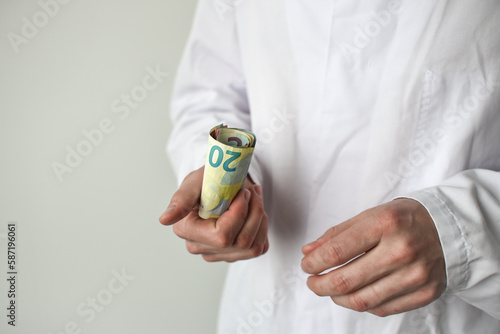 Wallpaper Mural Euro banknotes in doctor's hands Torontodigital.ca