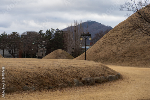 Bonghwangdae Seobongchong tombs during winter afternoon cloudy day at Gyeongju , South Korea : 10 February 2023 photo