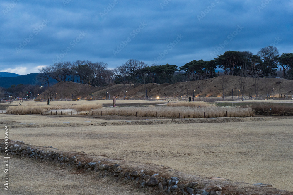 Beautiful view and nature around Ancient Tombs in Inwang-dong during winter evening at Gyeongju , South Korea : 10 February 2023 Beautiful view and nature around Ancient Tombs in Inwang-dong during winter evening at Gyeongju , South Korea : 10 February 2023
