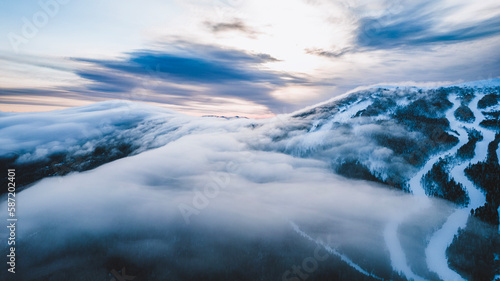 A blanket of clouds sit over Saddleback Ski area, Maine in winter