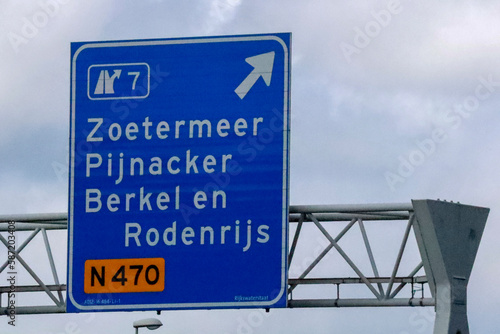 Blue signpost on the highway A12 to N470 Zoetermeer and Pijnackter