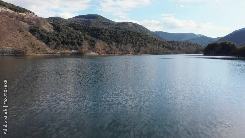 Low altitude drone flight over calm and quiet Mountain lake sunny summer day Low altitude drone flight over calm and quiet Mountain lake sunny summer day