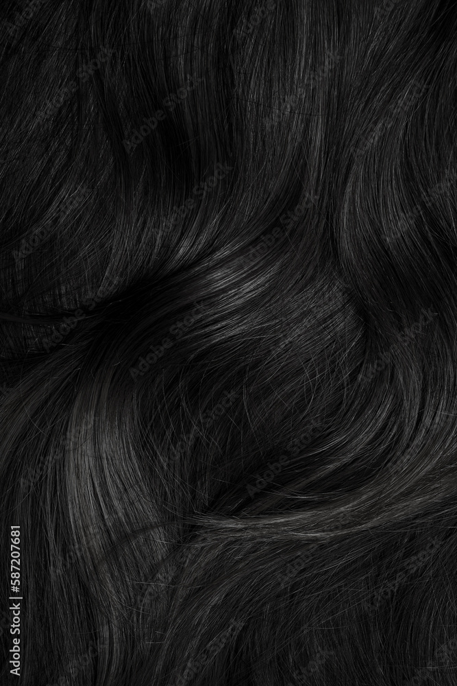 Naklejka premium Brunette or black hair. Female long dark hair in black. Beautifully laid curls. Closeup texture in a dark key. Hairdressing, hair care and coloring. Shading gray hair. Background with copy space.