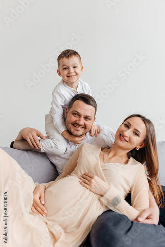 happy family with pregnant woman and 4 old son