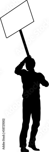Protestor or demonstrator at a demonstration march, picket line or strike protest rally in silhouette. Holding up a banner or picket sign board placard.