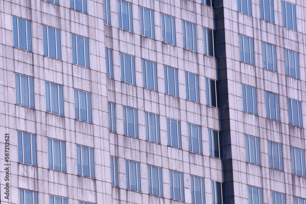 Tall building background, Side of the building with windows and door.