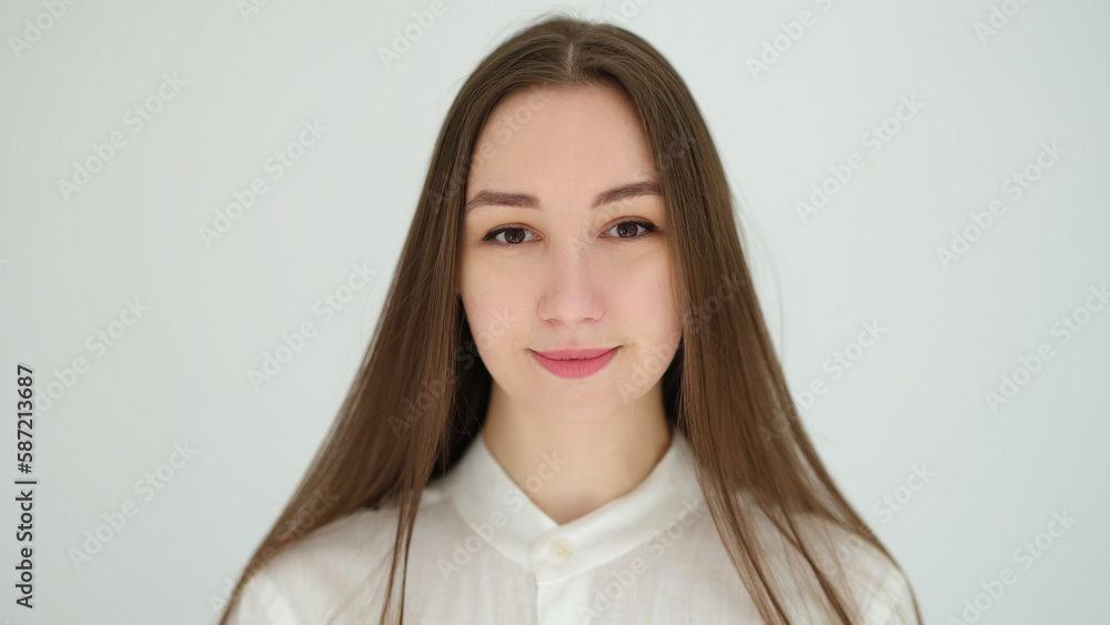 Portrait of young caucasian woman with long hair on white background. Healthy lifestyle concept Portrait of young caucasian woman with long hair on white background. Healthy lifestyle concept