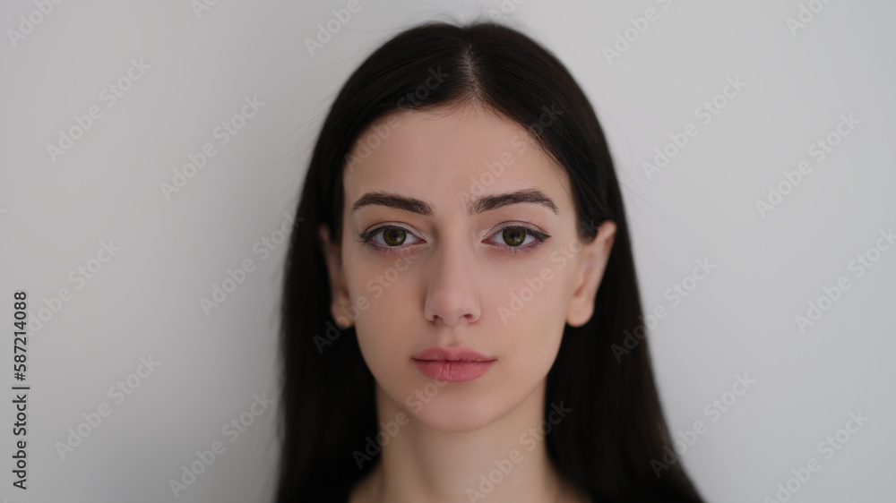 Portrait of brunette indian woman with long hair on white background. Natural female beauty concept Portrait of brunette indian woman with long hair on white background. Natural female beauty concept