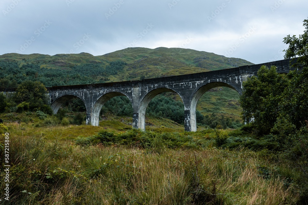 Beautiful shot of a historic arched bridge over the Glenfinnan Viaduct in Scotland
