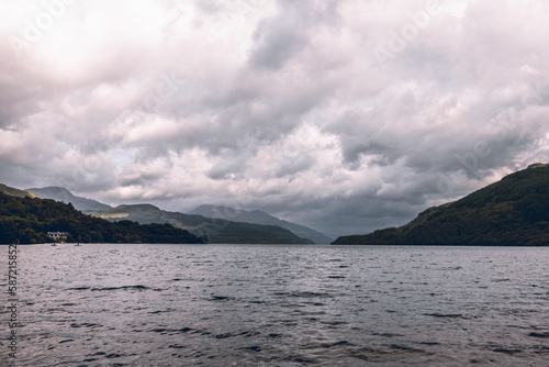 Beautiful cloudy sky over Loch Lomond Lake in the mountains in Scotland