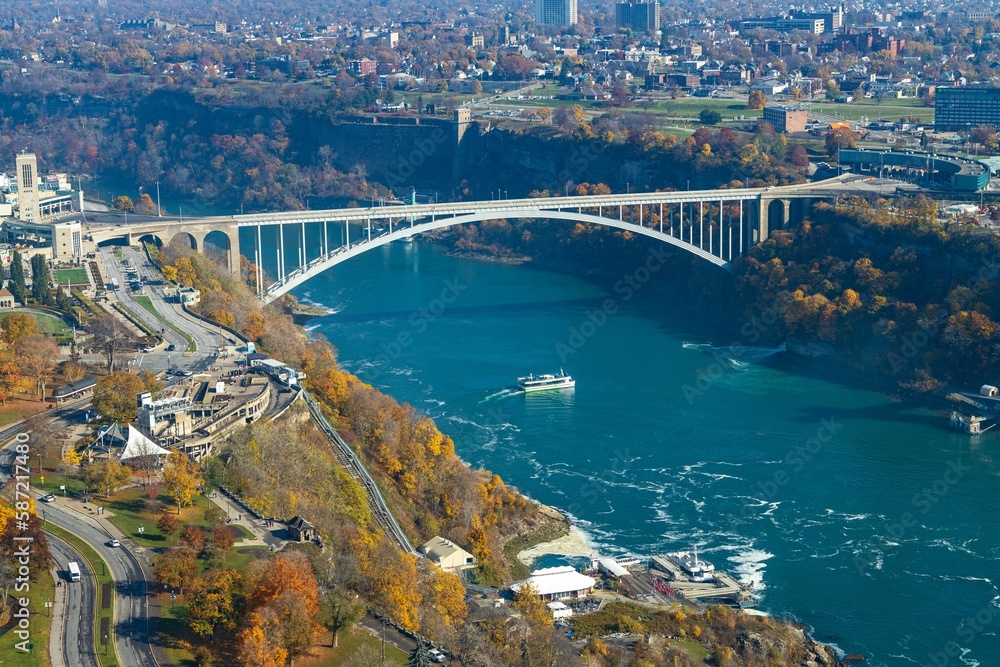 Aerial shot of the Rainbow arch bridge over the Niagara river in the city of Niagara Falls
