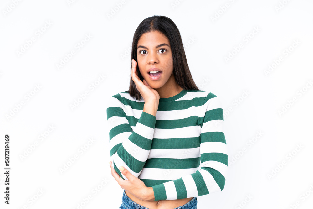 Young African American woman isolated on white background surprised and shocked while looking right Young African American woman isolated on white background surprised and shocked while looking right