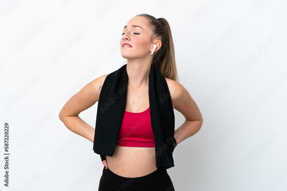 Young sport caucasian woman isolated on white background suffering from backache for having made an effort Young sport caucasian woman isolated on white background suffering from backache for having made an effort