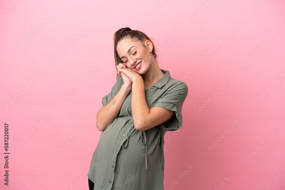 Young woman isolated on pink background pregnant and happy Young woman isolated on pink background pregnant and happy