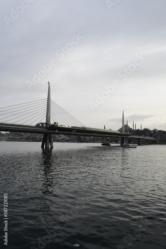 Long exposure. View of Haliç Metro Bridge connecting Azapkapı (Beyoğlu) and Unkapanı (Fatih) (Halic Metro Bridge). blue sky Istanbul Turkey