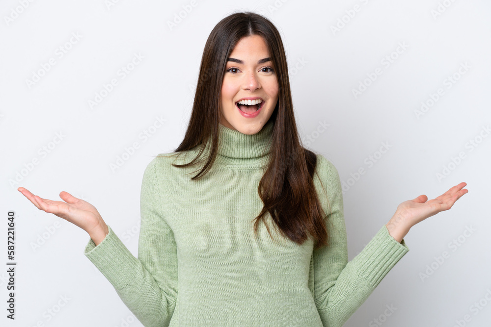 Young Brazilian woman isolated on white background with shocked facial expression Young Brazilian woman isolated on white background with shocked facial expression