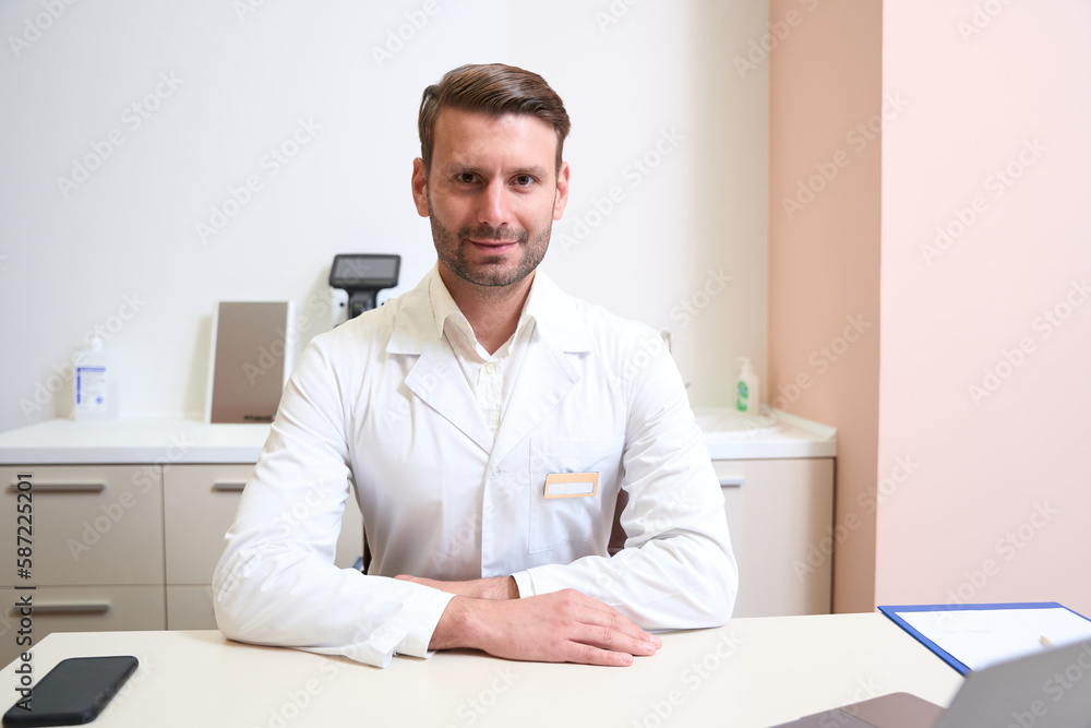 Handsome bearded man is posing in the ophthalmology cabinet Handsome bearded man is posing in the ophthalmology cabinet