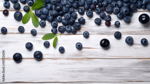 Blueberries on a white wooden table with copy space. Top view.