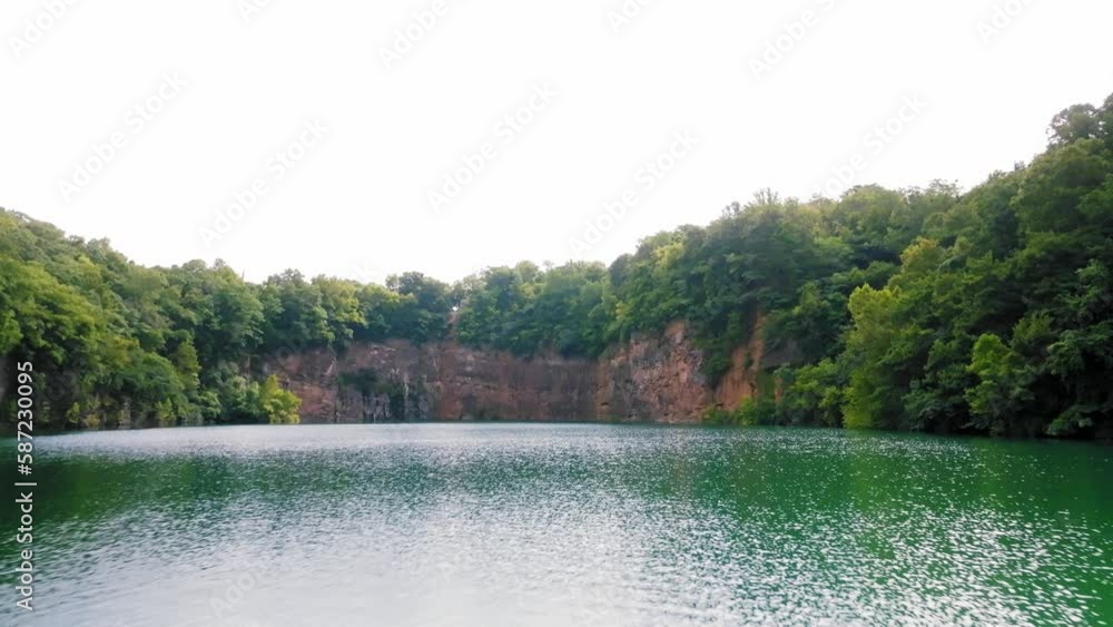 Knoxville, Tn. Aerial drone tilt-up movement, hovering the water at Fort Dickerson Quarry in Knoxville Knoxville, Tn. Aerial drone tilt-up movement, hovering the water at Fort Dickerson Quarry in Knoxville