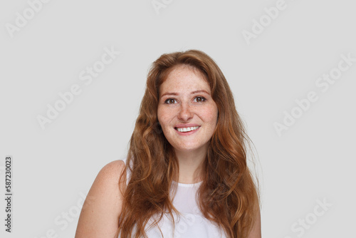 Beautiful mid adult woman with curly ginger hairstyle portrait
