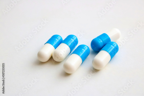 pills on blue background.