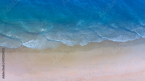 Fototapeta Naklejka Na Ścianę i Meble -  Aerial view with beach in wave of turquoise sea water shot, Top view of beautiful white sand background