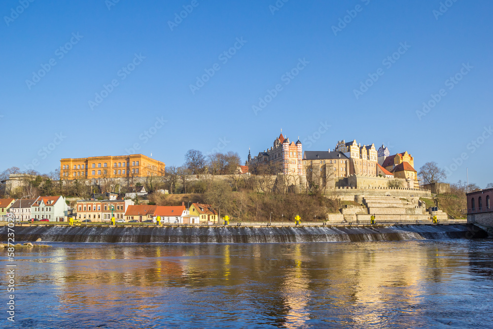 Fototapeta premium Castle and old houses on the Saale river in Bernburg, Germany