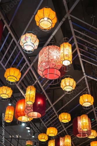Group of lights suspended from the ceiling in a restaurant in Bangkok