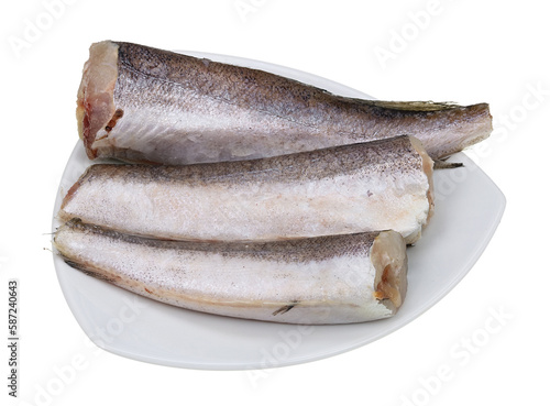 Defrosted raw hake lies on a triangular plate isolated